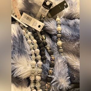 Black and White and Peacock Colored Beaded Strands